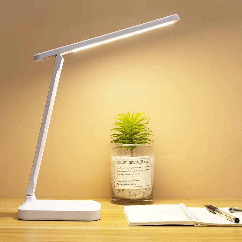 This LED desk lamp provides flicker-free, eye-protecting lighting with no blue light damage, making it perfect for extended use. Featuring a built-in phone holder and touch-sensitive dimming, it creates a comfortable and adjustable workspace for reading, studying, or video calls.