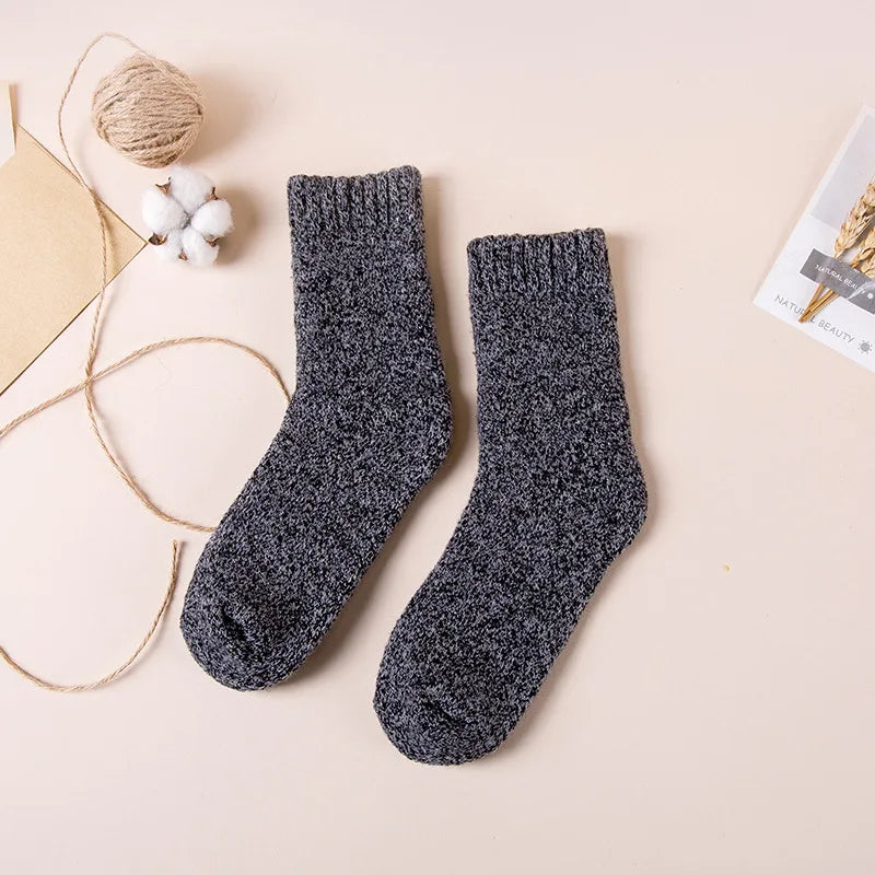 "Stay warm and comfortable with these thick wool socks, featuring a breathable knit design and mid-tube height for added coverage. Perfect for men, they’re ideal for casual wear during autumn and winter."