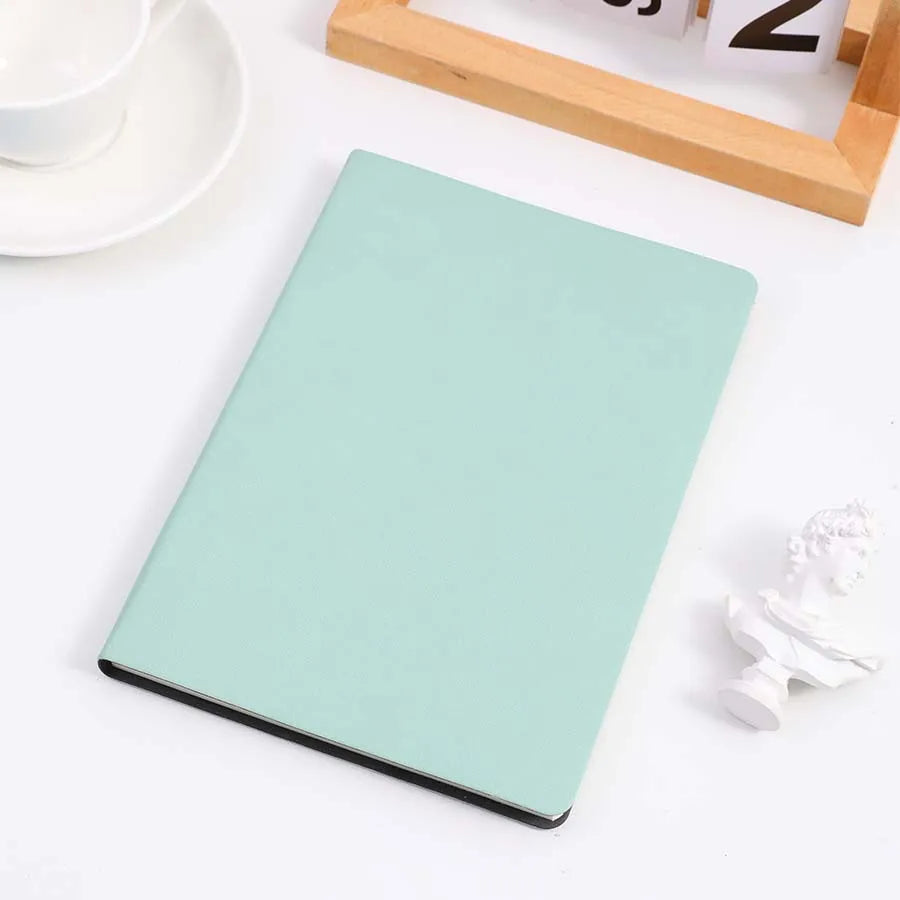 Tiffany cover notebook placed on a table, perfect for note-taking, journaling, and diaries. Features a sleek and minimalist design.